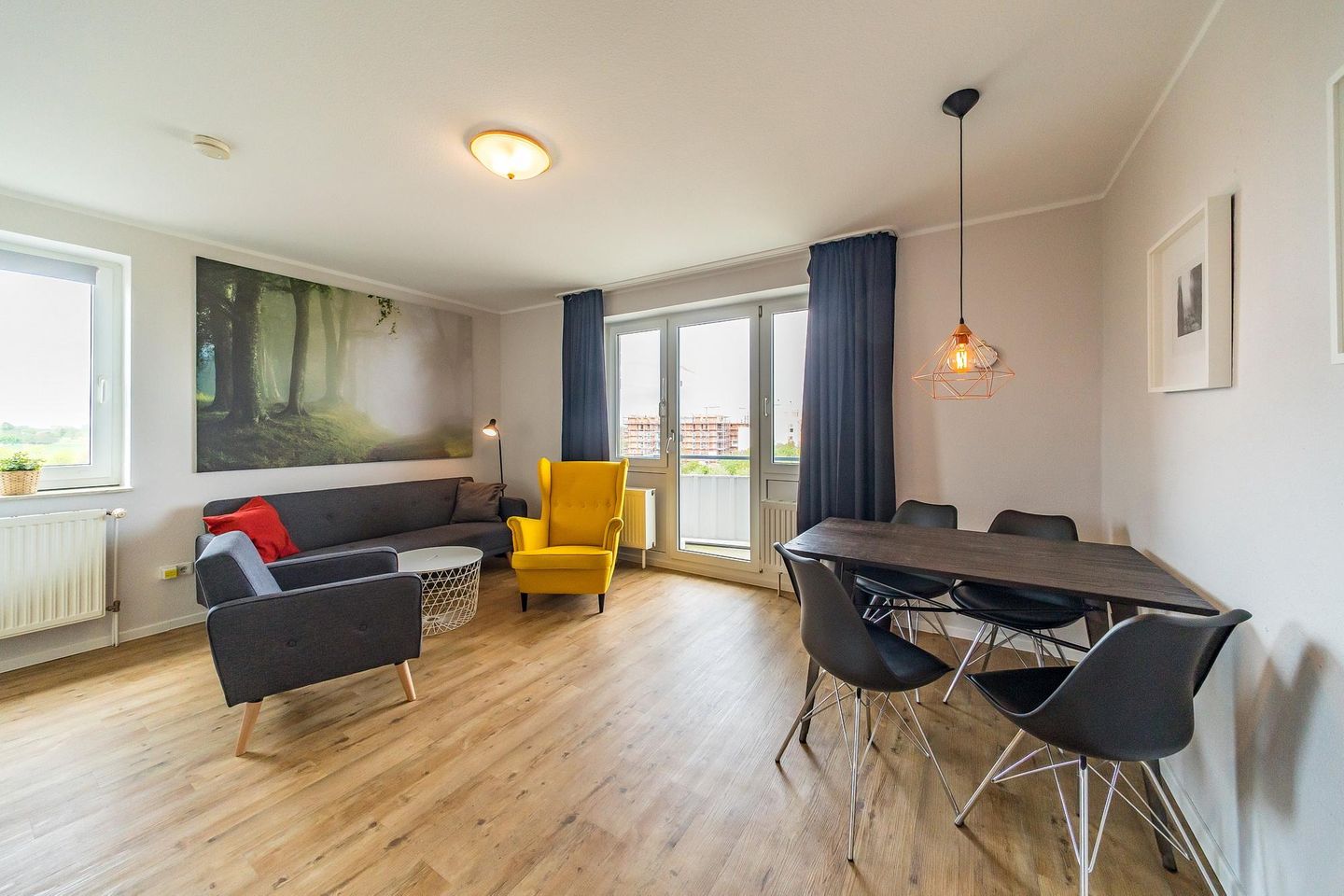 Hus Inselkieker Hus Inselkieker 425 Schillig - Wohnbereich mit Sofa, Sessel, Couchtisch und Esstisch