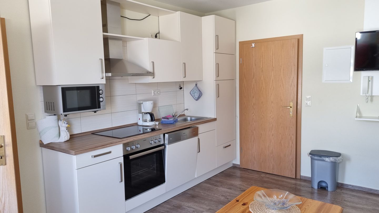 Haus Borkumitte Appartement Thor Haus Borkumitte - Wohnraum mit Küchenzeile