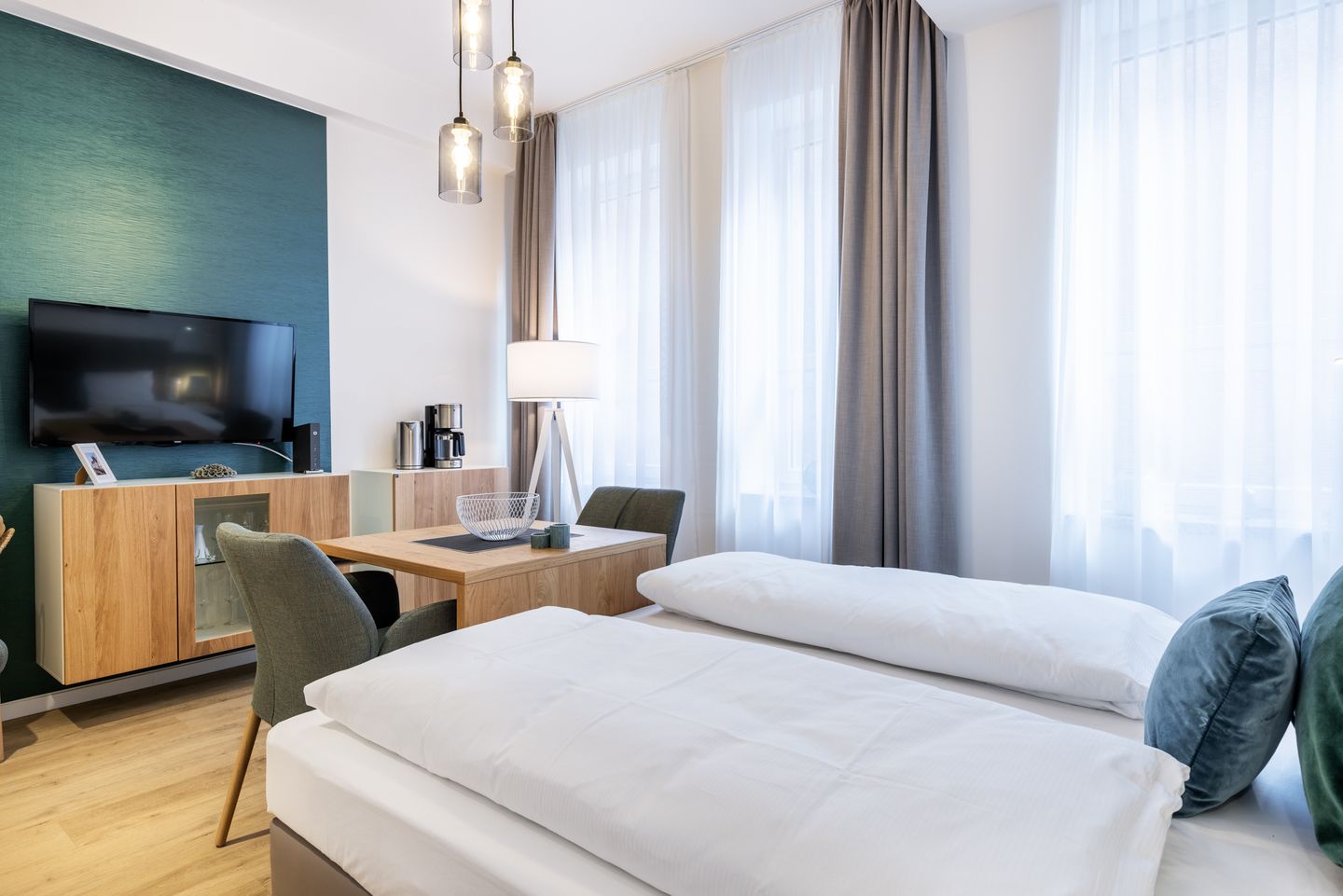 Ferienapartments am Krusespeicher Ferienapartments am Krusespeicher 2-22 Wismar - Wohn-/Schlafbereich mit Sitzgelegenheit