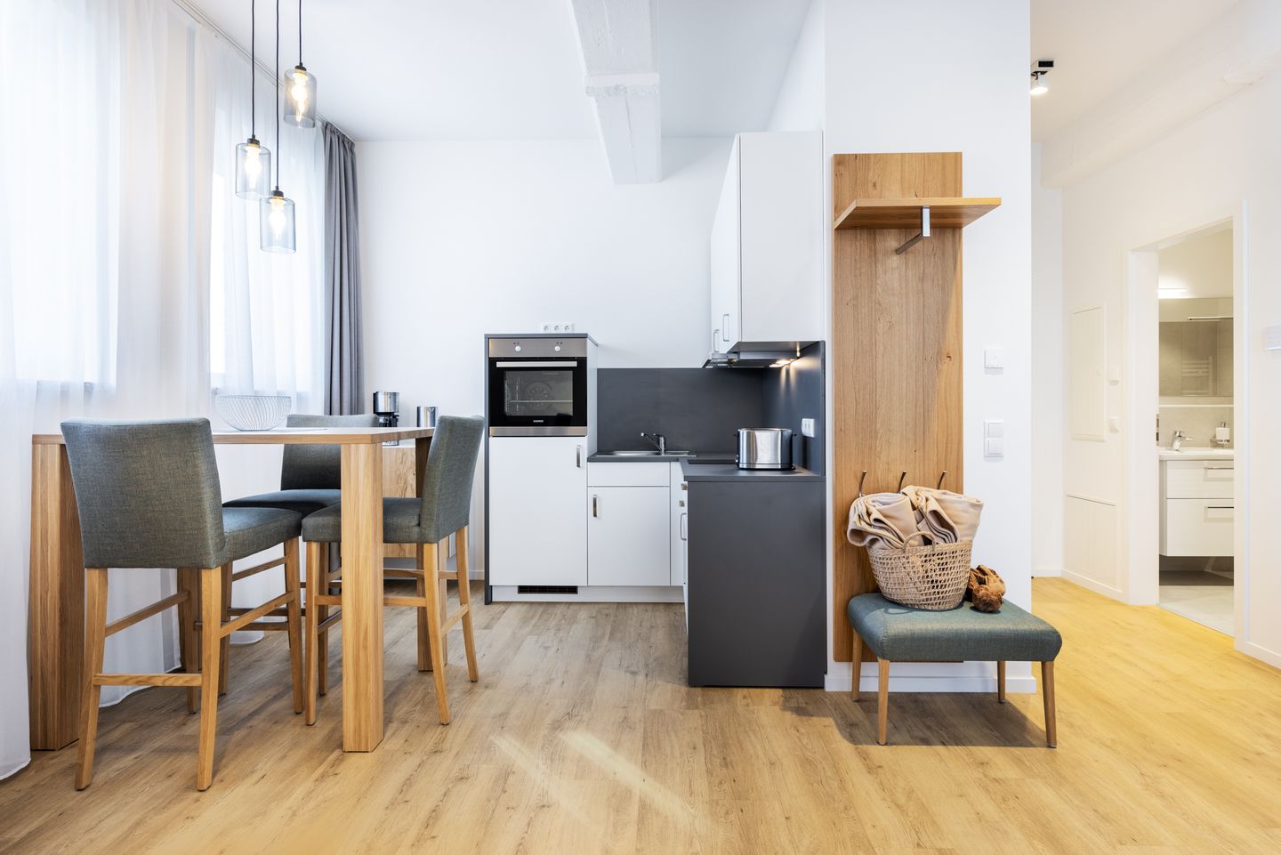 Ferienapartments am Krusespeicher Ferienapartments am Krusespeicher 1-09 Wismar - Wohn-/Essbereich mit Sitzgelegenheit