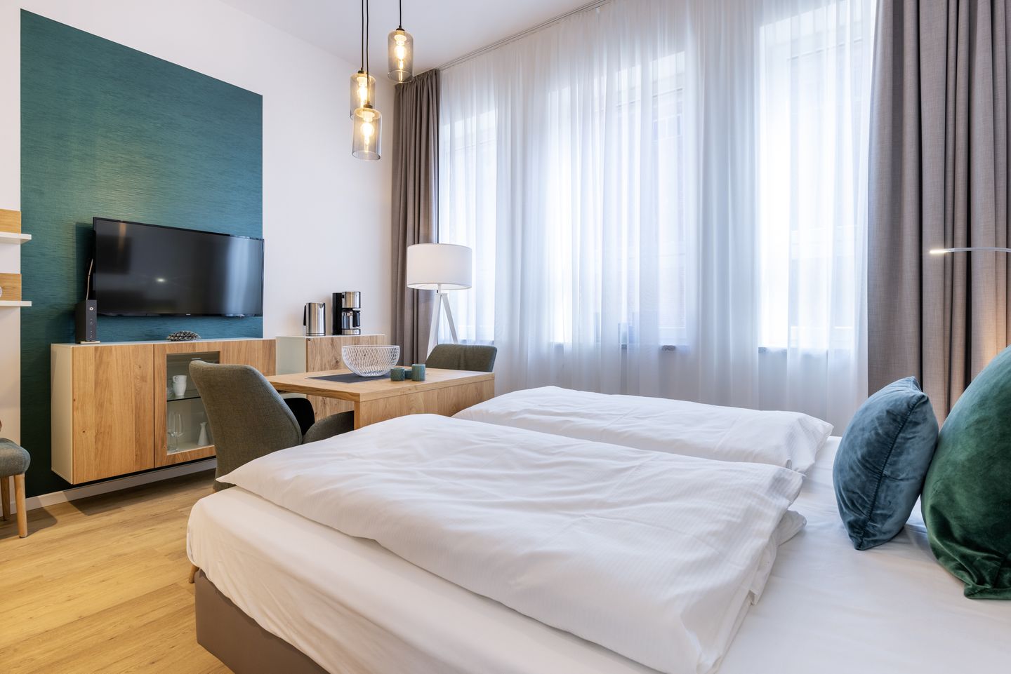 Ferienapartments am Krusespeicher Ferienapartments am Krusespeicher 3-32 Wismar - Wohn-/Schlafbereich mit Flatscreen-TV