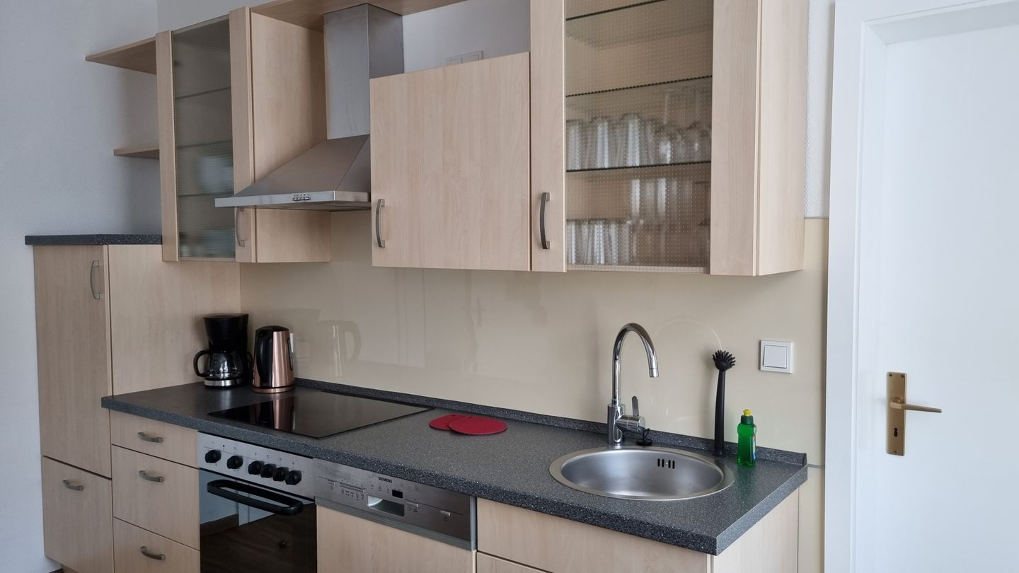 Haus Borkumitte Appartement Mellum Haus Borkumitte - Wohnzimmer mit Küchenzeile