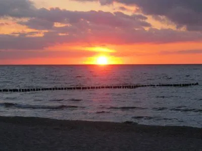 Strandbild mit Sonnenuntergang Residenz am Strand Wohnung 1-17