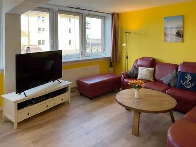 Wohnzimmer der Ferienwohnung "Willkommen bei den Hartmanns" in Wittdün auf Amrum Haus Nordenlicht Ferienwohnung „Willkommen bei den Hartmanns"