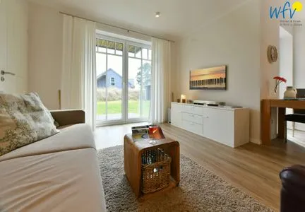 Wohnzimmer Bootshaus in den Dünen - 5 Ferienwohnung Dünengeflüster