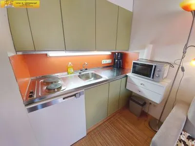 Küche / Küchenzeile Apartment Grimmingblick by FiS - Fun in Styria