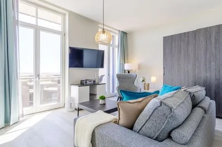 Ferienwohnung Große Welle Ostseebad Wustrow - ZweiWasser Alte Seefahrtschule Wohnzimmer  Große Welle