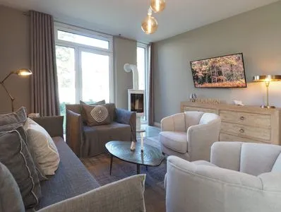 Wohnzimmer Reethus 54° Loddin mit Sauna und Kamin