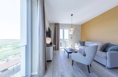 Ferienwohnung Boddenidylle Ostseebad Wustrow ZweiWasser Alte Seefahrtschule Wohnzimmer mit Ausblick  Boddenidylle