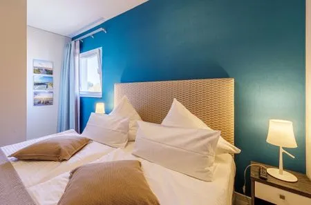 Ferienwohnung Dünenquartier Ostseebad Wustrow ZweiWasser Alte Seefahrtschule Schlafzimmer  Dünenquartier