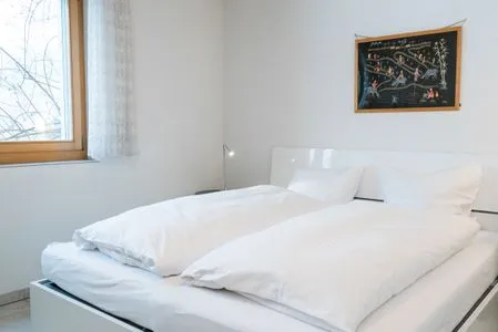 Bedroom with cozy double bed Apartment Grossgaden