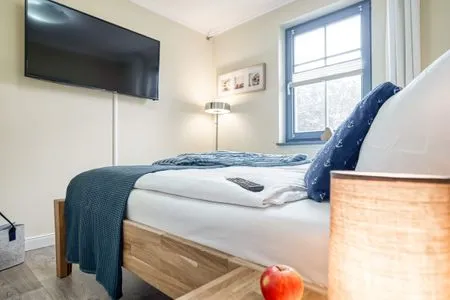 Schlafzimmer mit Doppelbett  Birkmaase 10 - Wohnung 1