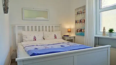 Schlafzimmer mit Doppelbett  Kapitänsgarten Wohnung 25