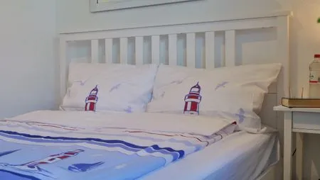 Schlafzimmer mit Doppelbett  Kapitänsgarten Wohnung 25