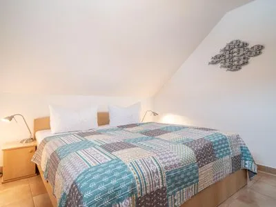 Schlafzimmer mit Doppelbett Residenz am Strand Wohnung 5-73