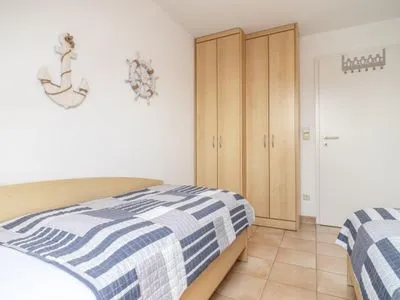 Schlafzimmer mit zwei Einzelbetten Residenz am Strand Wohnung 5-73