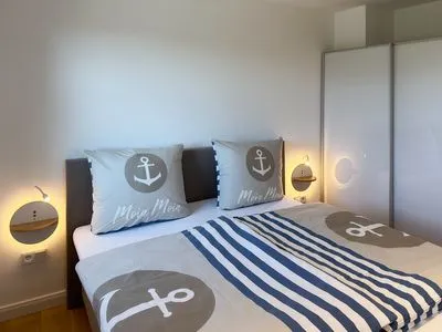Schlafzimmer Haus Dünenperle Ferienwohnung "Dünengras"