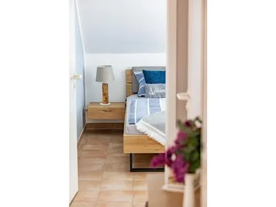 Blick in das Schlafzimmer Residenz am Strand Wohnung 6-80
