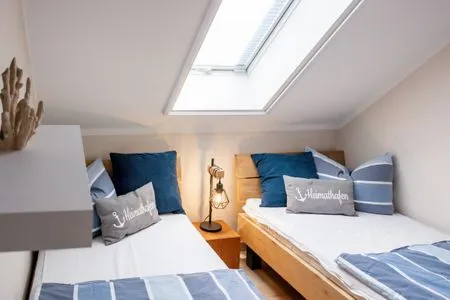 Schlafzimmer mit zwei Einzelbetten Residenz am Strand Wohnung 6-80