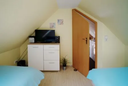 Schlafzimmer mit Einzelbetten Ferienpark Freesenbruch Wohnung 3.6 - Frieda
