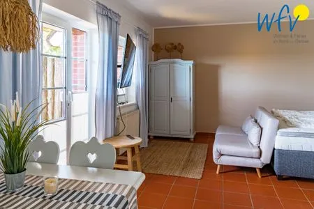 Wohnzimmer Ferienhaus am Gutspark Dranske Ferienwohnung Sonnengarten