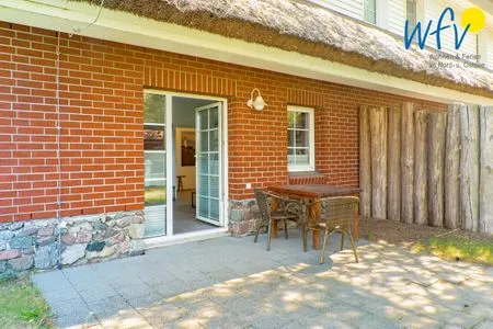 Terrasse Ferienhaus am Gutspark Dranske Ferienwohnungen Sonnenaufgang und Sonnentag