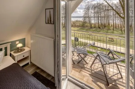 Seezauber Sietow Einfamilienhaus Schlafzimmer mit Balkon  SeeZauber