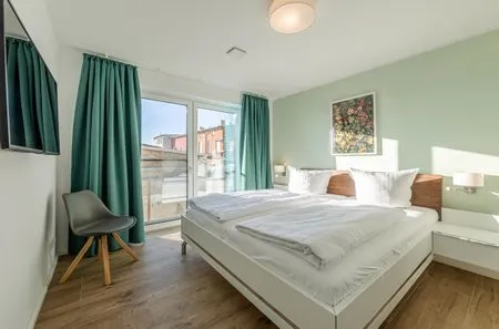 Ferienwohnung Wasserlilie Malchow Blick in eines der Schlafzimmer  Wasserlilie