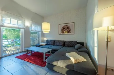 Ferienwohnung Stockente Wohnzimmer mit Zugang zur Terasse  Stockente