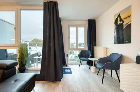 Ferienwohnung Ostseeschatz Aparthotel Zingst - Wohnzimmer  Ostseeschatz