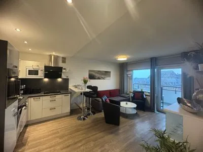 Küche offen zum Wohnbereich Ferienwohnung im Haus Nordland App 97