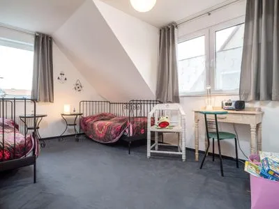 Schlafzimmer mit Einzelbetten in der 1. Etage  Ferienwohnung Ohana