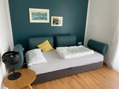 Wohnzimmer Apartment Gartenblick 7/4 EG mit überdachter Terrasse