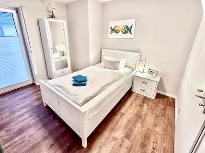 Schlafzimmer mit Einzelbett Parkresidenz am Hafen Wohnung HF 12 - "Luftsnapper´s"