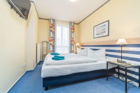 Schlafzimmer mit Doppelbett  Villa Kurpark - Wohnung 512