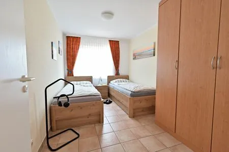 Schlafzimmer mit zwei Einzelbetten Residenz am Strand Wohnung 1-02