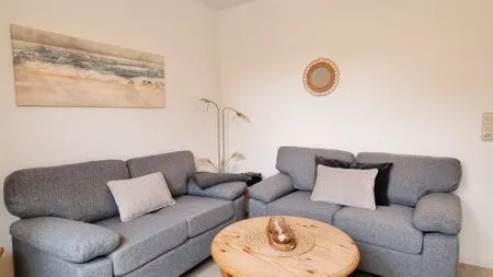 Wohnzimmer Ferienwohnung "Achtern Diek 1" 1. Reihe an der Ostseeküste