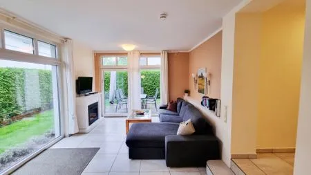 Wohnzimmer Ferienwohnung "Baltic Sunrise" mit Garten an der Ostseeküste