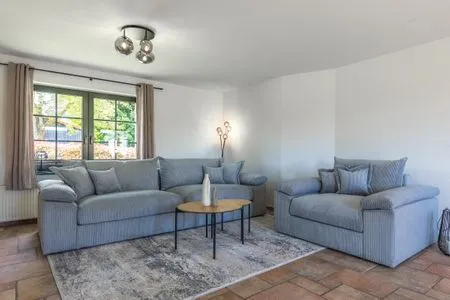 Ferienhaus Wiesenquartier Penkow Wohnzimmer mit großer Couch  WiesenQuartier