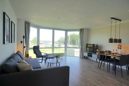 Wohnzimmer Moderne Ferienwohnung N°9 Stexwig mit Panorama Schleiblick