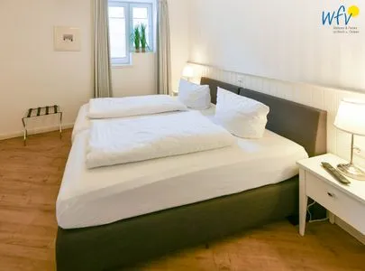 Schlafzimmer Ferienhaus "Meine Insel Juist" Ferienwohnung Düne