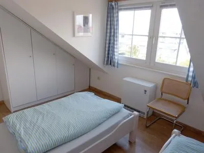 Schlafzimmer in der Ferienwohnung Alpenstrandläufer in Wittdün auf Amrum Haus *Südspitze 17* Ferienwohnung *Alpenstrandläufer*