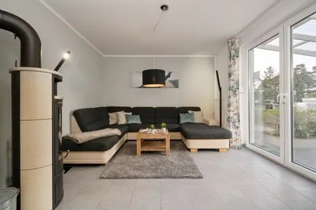 Ferienhaus Aurora Roebel Wohnzimmer mit Kamin  Aurora