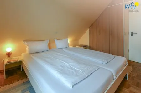 Schlafzimmer Haus Dünenblick Ferienwohnung 20