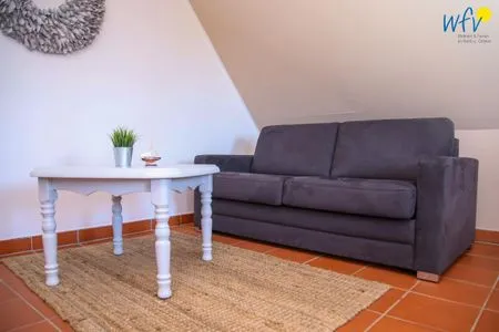 Wohnzimmer Ferienhaus am Gutspark Dranske Ferienwohnung Sonnenrose