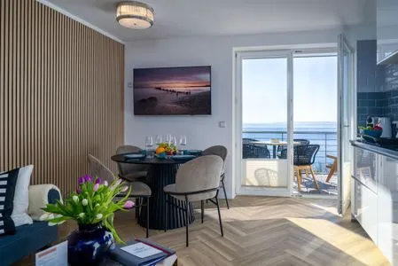 Wohnzimmer FeWo Meerzeit - Balkon, Sauna, Meerblick