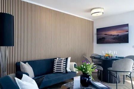 Wohnzimmer FeWo Meerzeit - Balkon, Sauna, Meerblick