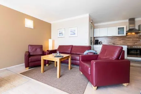 Wohnzimmer FeWo Fontane - Kamin, Sauna, Meerblick, Badeteich