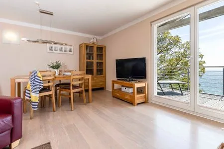 Wohnzimmer FeWo Horizont - Kamin, Sauna, Meerblick