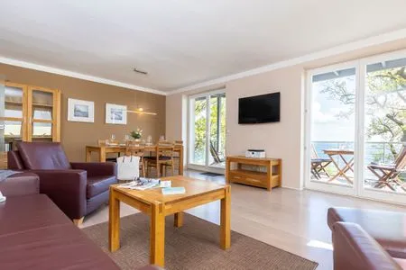 Wohnzimmer FeWo Wellenspiel - Kamin, Sauna, Meerblick